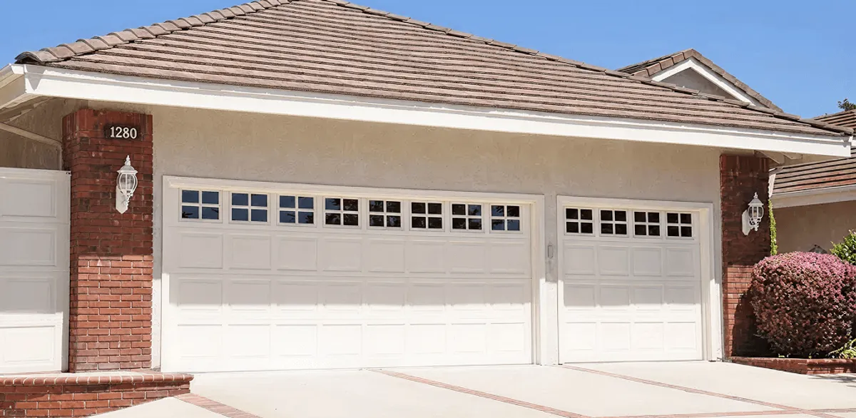 Residential garage door repair service for a double garage door in Seattle, WA