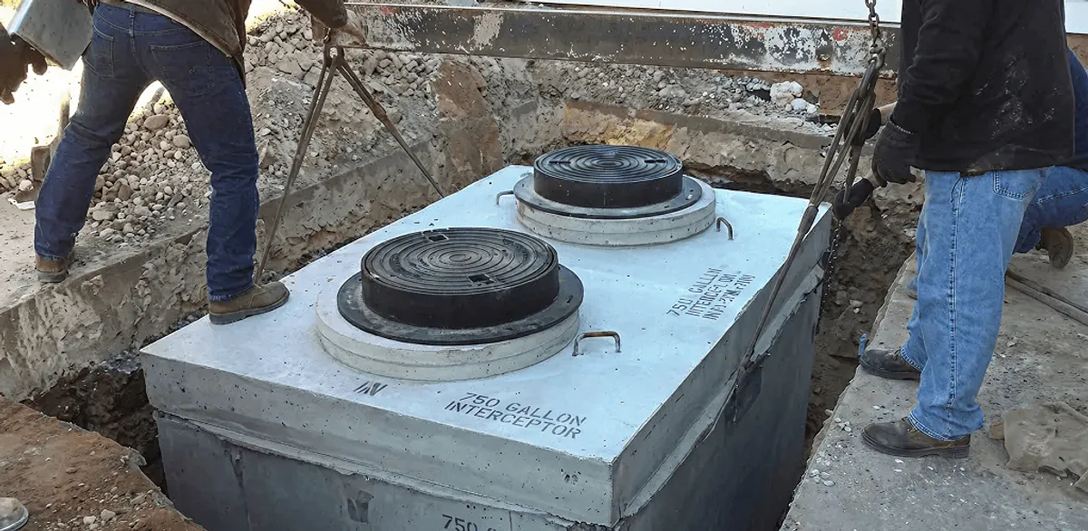 Grease trap installation for a commercial property drainage system in Seattle, WA