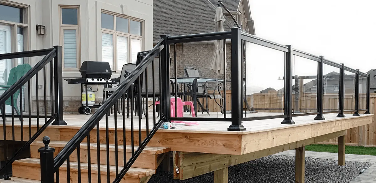 Handrail installation on a deck staircase for safety and code compliance in Seattle, WA